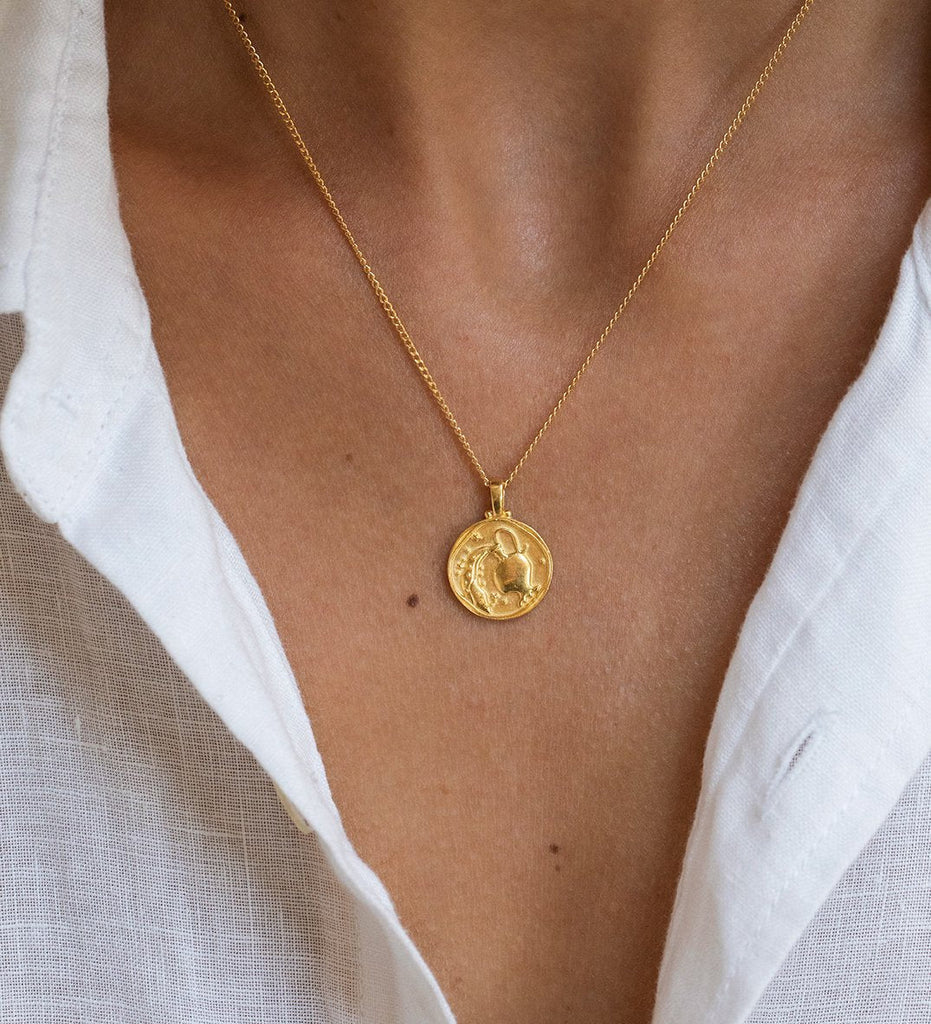 Gold-colored Aquarius 2024 Coin Pendant